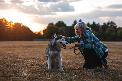 A Veteran on a peaceful walk with her dog