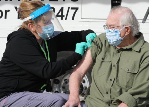 A man getting his COVID-19 vaccine