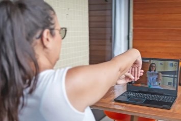 A Veterans does physical therapy over a video call